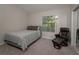 Bedroom with large window and comfortable chair at 1701 Brigadoon Dr, Clearwater, FL 33759