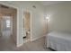 Bedroom leading to ensuite bathroom and hallway with view at 1701 Brigadoon Dr, Clearwater, FL 33759