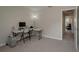 Spacious bedroom with neutral carpet, a large window and plenty of space for office furniture at 1701 Brigadoon Dr, Clearwater, FL 33759