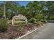 Brigadoon of Clearwater sign surrounded by landscaping and situated on a lush, tree-lined road at 1701 Brigadoon Dr, Clearwater, FL 33759