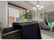 Dining area with large window, dining table, adjacent seating, and natural light at 1701 Brigadoon Dr, Clearwater, FL 33759