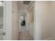 Hallway leading to laundry room and living room at 1701 Brigadoon Dr, Clearwater, FL 33759