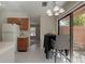 Open kitchen flows to patio doors, dining space, and bright natural lighting at 1701 Brigadoon Dr, Clearwater, FL 33759