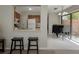 Kitchen view featuring a pass-through to the dining area with stools at 1701 Brigadoon Dr, Clearwater, FL 33759