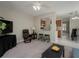 View of living room connected to kitchen with bar seating at 1701 Brigadoon Dr, Clearwater, FL 33759