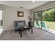 Cozy living room featuring a sliding glass doors to outdoor patio at 1701 Brigadoon Dr, Clearwater, FL 33759