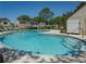 Enjoy this community pool with plenty of seating and a view of the neighborhood at 1701 Brigadoon Dr, Clearwater, FL 33759