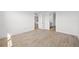Bright bedroom with wood-look tile flooring and access to a bathroom and other rooms at 1895 Ridgemore St, North Port, FL 34289