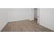 Bedroom with tile floors, neutral paint, and a door leading to other parts of the home at 1895 Ridgemore St, North Port, FL 34289