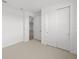 Neutral bedroom featuring carpet flooring and closet at 1895 Ridgemore St, North Port, FL 34289