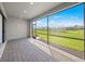 Covered patio with screened windows showcasing a large landscaped yard on a sunny day at 1895 Ridgemore St, North Port, FL 34289