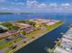 Scenic aerial view of waterfront condos with lush landscaping and community boat docks at 19029 Us Highway 19 N # 21E, Clearwater, FL 33764