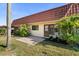 Charming single-story home with a red tile roof, a brick patio, and mature landscaping at 19029 Us Highway 19 N # 21E, Clearwater, FL 33764