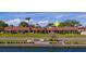 Charming waterfront townhomes with a tile roof, lush landscaping, and canal views at 19029 Us Highway 19 N # 21E, Clearwater, FL 33764