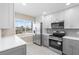 Beautifully renovated kitchen featuring stainless steel appliances and bright, natural light at 19029 Us Highway 19 N # 21E, Clearwater, FL 33764