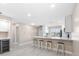 Open-concept kitchen with barstool seating and a clean, modern design for stylish living at 19029 Us Highway 19 N # 21E, Clearwater, FL 33764