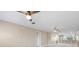 Bright living room showcasing a modern ceiling fan, recessed lighting, and an open floor plan at 19029 Us Highway 19 N # 21E, Clearwater, FL 33764