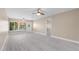 Inviting living area featuring plenty of natural light and outdoor access through a glass door at 19029 Us Highway 19 N # 21E, Clearwater, FL 33764