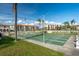 Community shuffleboard courts with lush landscaping and views of nearby condos and a pool at 19029 Us Highway 19 N # 21E, Clearwater, FL 33764