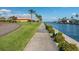Scenic view of waterfront property with landscaped walkway and boat access at 19029 Us Highway 19 N # 21E, Clearwater, FL 33764