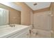 Bathroom featuring a white vanity and a shower-tub combination with tile surround at 2263 Fluorshire Dr, Brandon, FL 33511