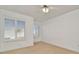 This bedroom features neutral walls, carpet, and two windows with wooden blinds at 2263 Fluorshire Dr, Brandon, FL 33511