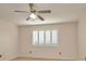 This bedroom features neutral walls, carpet, and plantation shutters on the window at 2263 Fluorshire Dr, Brandon, FL 33511
