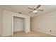 Neutral bedroom featuring carpet, a ceiling fan, and an open closet at 2263 Fluorshire Dr, Brandon, FL 33511