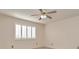 This bedroom features neutral walls, carpet, and plantation shutters on the window at 2263 Fluorshire Dr, Brandon, FL 33511