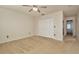 Neutral bedroom featuring carpet, a ceiling fan, and a double door closet at 2263 Fluorshire Dr, Brandon, FL 33511