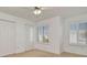 This bedroom features neutral walls, carpet, two windows, and a double door closet at 2263 Fluorshire Dr, Brandon, FL 33511