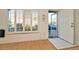 Bright entryway with natural light, wood floors, and white trim at 2263 Fluorshire Dr, Brandon, FL 33511