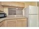 Bright kitchen features a pass through to the laundry room at 2263 Fluorshire Dr, Brandon, FL 33511