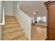Bright living room features wood floors, carpeted stairs and large windows at 2263 Fluorshire Dr, Brandon, FL 33511