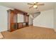 View of open concept living room with built-in cabinets and light wood flooring at 2263 Fluorshire Dr, Brandon, FL 33511