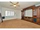 Spacious living room with light wood flooring, bright windows and cabinets at 2263 Fluorshire Dr, Brandon, FL 33511