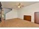 Open floor plan with light wood flooring, ceiling fan and staircase at 2263 Fluorshire Dr, Brandon, FL 33511