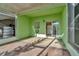 View of a covered patio with a sliding door to the home's interior and ample space for outdoor seating at 2263 Fluorshire Dr, Brandon, FL 33511