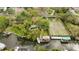 Breathtaking aerial view of a waterfront property featuring boat dock, swimming pool, and lush landscaping at 2632 S Dundee St, Tampa, FL 33629