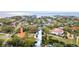 Aerial view showcases waterfront homes, boat docks, and lush tropical landscaping at 2632 S Dundee St, Tampa, FL 33629