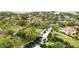 Aerial view of waterfront homes and community with boat docks, canals, and green spaces at 2632 S Dundee St, Tampa, FL 33629