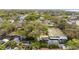 Aerial view of a waterfront property on a tranquil waterway, featuring lush greenery and surrounding upscale homes at 2632 S Dundee St, Tampa, FL 33629