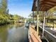 Waterfront canal featuring multiple covered boat docks and boat lifts at 2632 S Dundee St, Tampa, FL 33629