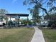 Lush backyard with a covered boat dock and lift providing easy water access and storage at 2632 S Dundee St, Tampa, FL 33629