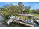 Boat dock on canal featuring covered boat lift and outdoor seating area at 2632 S Dundee St, Tampa, FL 33629
