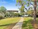 A well-maintained boat dock featuring a covered lift and easy water access, surrounded by lush landscaping at 2632 S Dundee St, Tampa, FL 33629