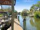 View of the waterfront with private dock and boat lift on a beautiful waterway at 2632 S Dundee St, Tampa, FL 33629