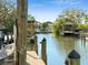 View of the canal featuring multiple covered boat docks and beautiful waterfront homes at 2632 S Dundee St, Tampa, FL 33629