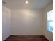 Bright and airy bedroom with a large window, sleek laminate flooring, and neutral paint at 31888 Treasure Dock Isle, Wesley Chapel, FL 33545