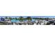 Expansive community pool and recreation area featuring a sandy beach, water slides, and tropical landscaping at 31888 Treasure Dock Isle, Wesley Chapel, FL 33545
